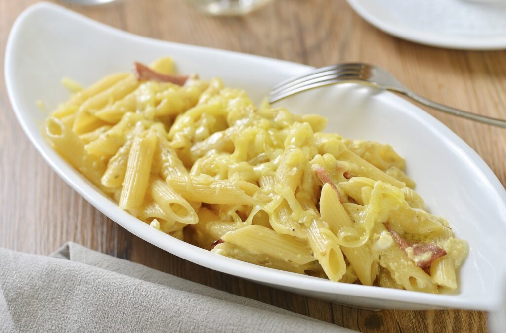 Mac and Cheese: Creamy and cheesy Mac and Cheese in a bowl.